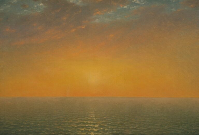 under a warm orange sky